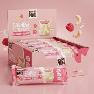 Bio Cashew Butter Cups Raspberry Rumble in Verpackung, mit Himbeeren und Cashewkernen